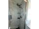 Updated shower with marble tile and modern fixtures at 1540 Skyview Ct, Lakeland, FL 33801