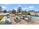 Relaxing backyard with pool, patio furniture, and play area at 155 Kissengen Park Blvd, Bartow, FL 33830