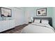 Virtually staged bedroom with gray headboard and white dresser at 155 Kissengen Park Blvd, Bartow, FL 33830