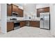 Modern kitchen featuring stainless steel appliances and granite countertops at 155 Kissengen Park Blvd, Bartow, FL 33830