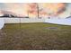 Fenced-in backyard with grassy area at 1726 Eagle Hammock Blvd, Eagle Lake, FL 33839