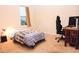 Simple bedroom with a bed, desk, and gaming chair at 1726 Eagle Hammock Blvd, Eagle Lake, FL 33839