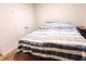 Bright bedroom with double bed and built-in closet at 1726 Eagle Hammock Blvd, Eagle Lake, FL 33839