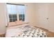 Bedroom with a double bed, window, and a closet at 1726 Eagle Hammock Blvd, Eagle Lake, FL 33839