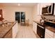 Modern kitchen with stainless steel appliances and granite countertops at 1726 Eagle Hammock Blvd, Eagle Lake, FL 33839