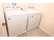 Bright laundry room with Whirlpool washer and dryer at 1726 Eagle Hammock Blvd, Eagle Lake, FL 33839