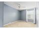 Simple bedroom with ceiling fan and neutral walls at 1801 Quail Hill Dr, Lakeland, FL 33810