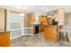 Open dining area with breakfast bar and wood cabinets at 1801 Quail Hill Dr, Lakeland, FL 33810