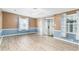 Living room with wood-look floors and sliding glass doors at 1801 Quail Hill Dr, Lakeland, FL 33810