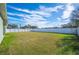 Large backyard with grass and white fence at 1836 James Towne Ln, Bartow, FL 33830