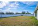 Large backyard with grass and white fence at 1836 James Towne Ln, Bartow, FL 33830