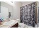 Clean bathroom with a shower/tub combo and floral shower curtain at 1836 James Towne Ln, Bartow, FL 33830