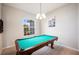 Game room featuring a pool table and large window at 1836 James Towne Ln, Bartow, FL 33830