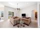 Spacious living room with high ceilings, comfortable seating, and natural light at 1836 James Towne Ln, Bartow, FL 33830