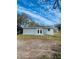 Rear view of house, double doors and landscaping at 2006 Kendrick Ln, Lakeland, FL 33805