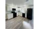 Modern kitchen featuring white cabinets and granite countertops at 2006 Kendrick Ln, Lakeland, FL 33805