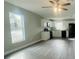 Open living room with gray walls and vinyl flooring at 2006 Kendrick Ln, Lakeland, FL 33805