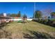 Backyard view, featuring a playset and lawn at 2070 Katie Ct, Winter Haven, FL 33884