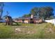 Backyard with playset and home exterior view at 2070 Katie Ct, Winter Haven, FL 33884