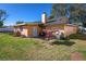 Home's back exterior, showing patio and yard at 2070 Katie Ct, Winter Haven, FL 33884