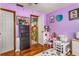 bedroom with purple walls and playful decor at 2070 Katie Ct, Winter Haven, FL 33884