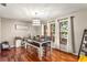 Bright dining area with a farmhouse table and hardwood floors at 2070 Katie Ct, Winter Haven, FL 33884