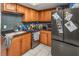 Galley kitchen with wood cabinets and stainless steel appliances at 2070 Katie Ct, Winter Haven, FL 33884