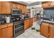 Kitchen with stainless steel appliances and wood cabinets at 2070 Katie Ct, Winter Haven, FL 33884