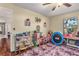 Playroom with toys, rug, and built-in storage at 2070 Katie Ct, Winter Haven, FL 33884