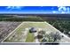 Aerial view of a home on a large lot with trees and road access at 2200 Mcclellan Rd, Frostproof, FL 33843