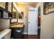 Bathroom with granite countertop and dark cabinets at 2227 Howard West Ave, Winter Haven, FL 33880