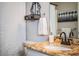 Bathroom vanity with granite countertop and oil rubbed bronze fixtures at 2227 Howard West Ave, Winter Haven, FL 33880