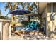 Wooden deck with blue chairs and striped rug at 2227 Howard West Ave, Winter Haven, FL 33880