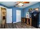 Home office with wood flooring, ample storage, and ceiling fan at 2227 Howard West Ave, Winter Haven, FL 33880