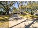 House exterior with driveway and mature trees at 2227 Howard West Ave, Winter Haven, FL 33880