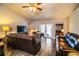 Relaxing living room featuring brown leather couches and wood-look floors at 2227 Howard West Ave, Winter Haven, FL 33880