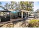 Outdoor patio area with seating and umbrella at 2227 Howard West Ave, Winter Haven, FL 33880