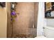 Clean shower with stone tile and built-in seat at 2227 Howard West Ave, Winter Haven, FL 33880