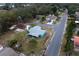 Aerial view of a charming light blue house with a screened porch at 2304 Honey Dr, Lakeland, FL 33801