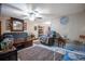 Cozy living room featuring a sofa, coffee table, and ceiling fan at 2304 Honey Dr, Lakeland, FL 33801