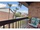 Relaxing balcony with brick wall and partial view of the community at 2369 Tom Jones St # 8, Orlando, FL 32839