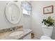 Simple half bathroom with granite countertop and oval mirror at 2369 Tom Jones St # 8, Orlando, FL 32839