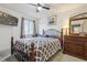 Main bedroom with dark wood furniture and ceiling fan at 2369 Tom Jones St # 8, Orlando, FL 32839