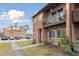 Brick townhouse with balcony and parking lot view at 2369 Tom Jones St # 8, Orlando, FL 32839