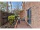 Cozy brick patio with grill and small garden at 2369 Tom Jones St # 8, Orlando, FL 32839