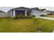 Front yard view of a house with a neatly landscaped lawn at 2610 San Marco Way, Winter Haven, FL 33884