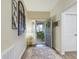 Inviting foyer boasts decor, neutral paint, wood floors and ample natural light at 2610 San Marco Way, Winter Haven, FL 33884