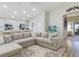 Spacious living room with a large sectional sofa and a fish tank at 2610 San Marco Way, Winter Haven, FL 33884