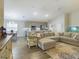Open-concept living space with modern furnishings and an eat-in kitchen at 2610 San Marco Way, Winter Haven, FL 33884