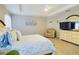 Main bedroom with light-toned furniture and en-suite bathroom at 2610 San Marco Way, Winter Haven, FL 33884